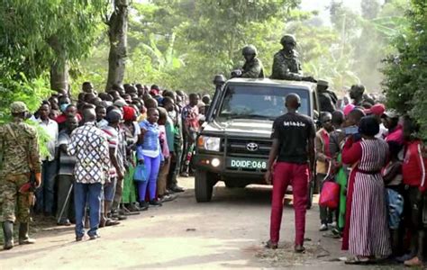 The mayor of Ugandan border town where suspected rebels attacked school says 41 bodies recovered, including 38 students